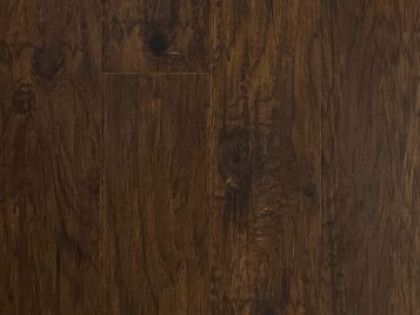 A close up of a dark brown wooden floor.