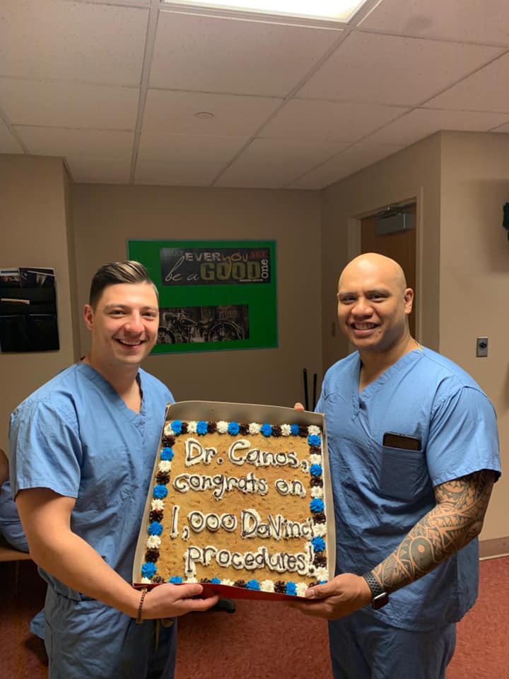 Doctors Holding Cake | Perrysburg, OH | Toledo Surgical Associates, Inc.