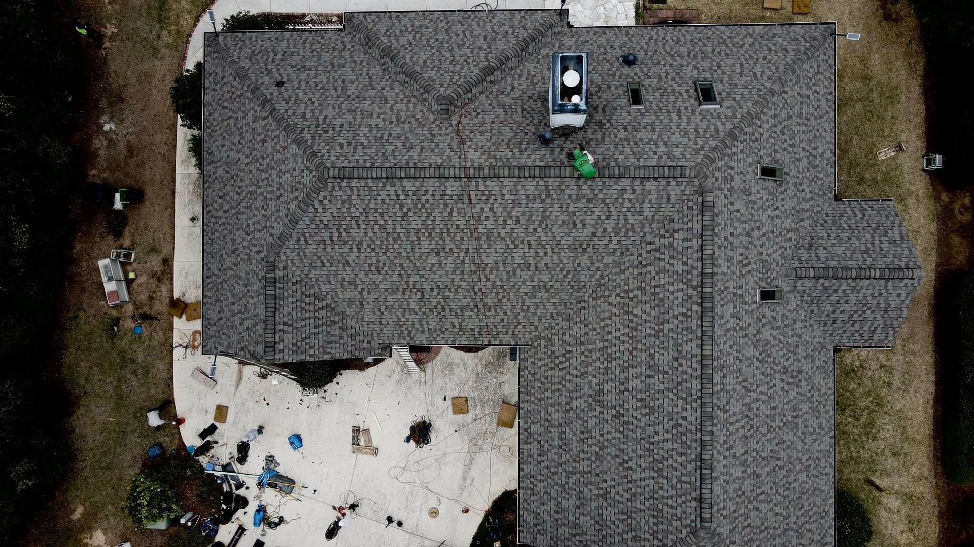An aerial view of a house with a roof that is being built.