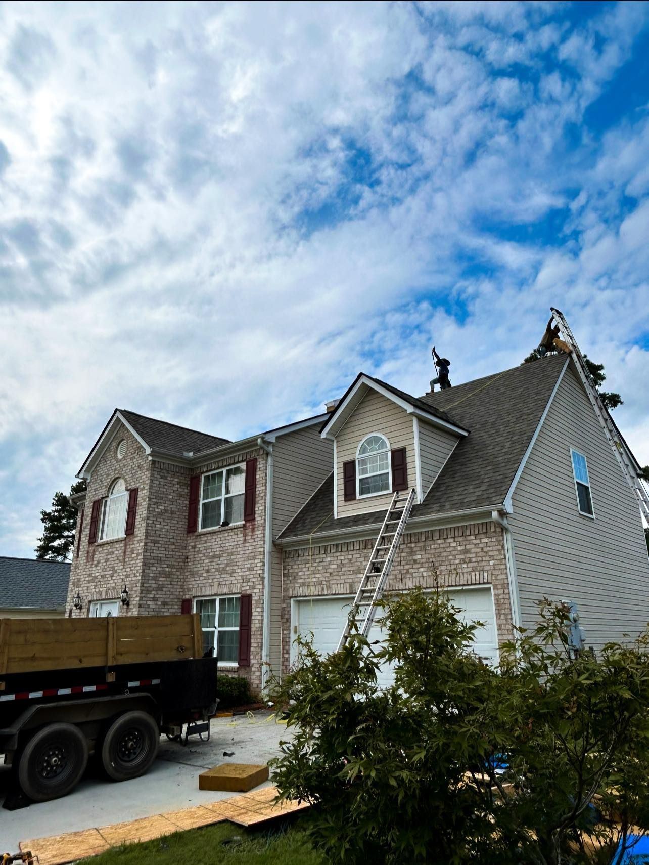 A house with a truck parked in front of it