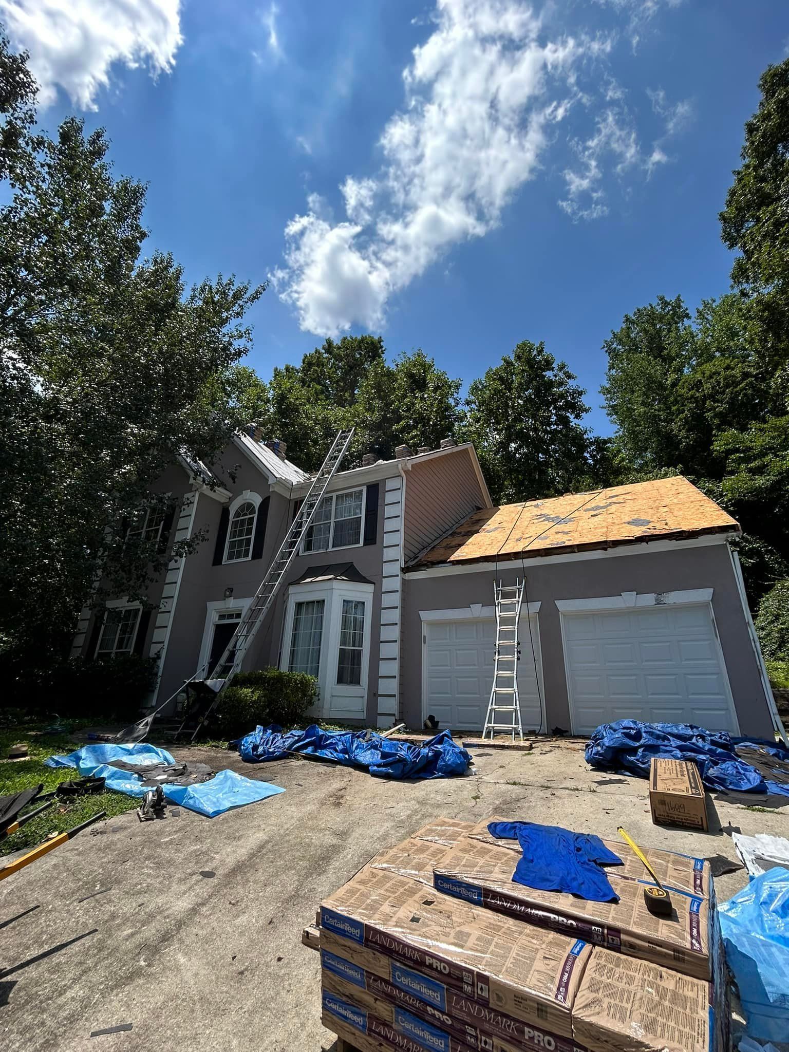A house is being remodeled with a new roof being installed.