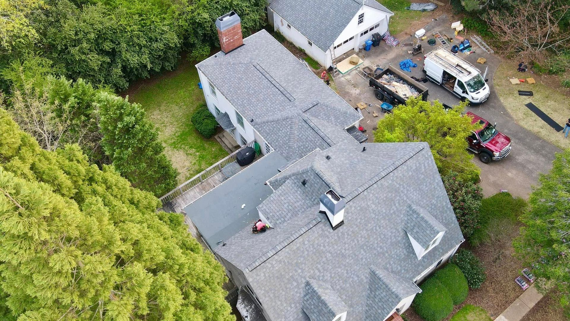 An aerial view of a house with a roof being installed.
