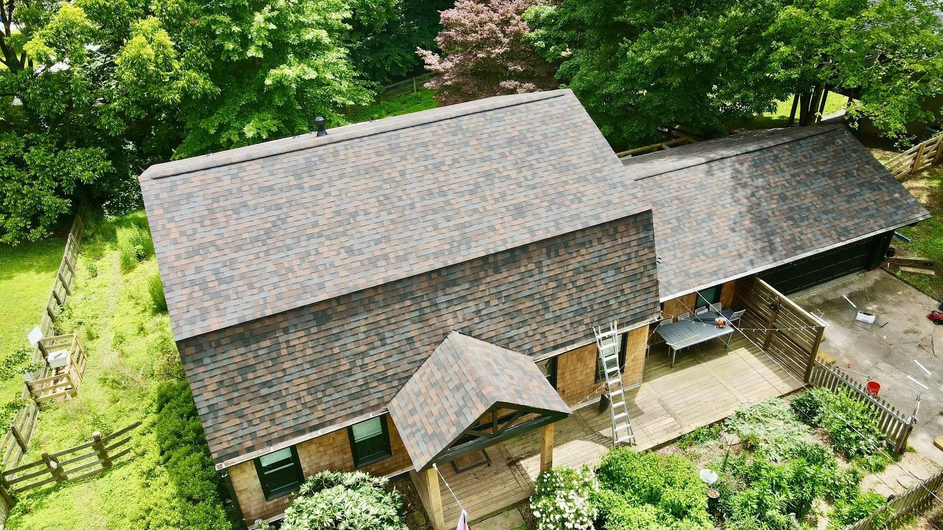 An aerial view of a house with a roof by Ringley Roofing.