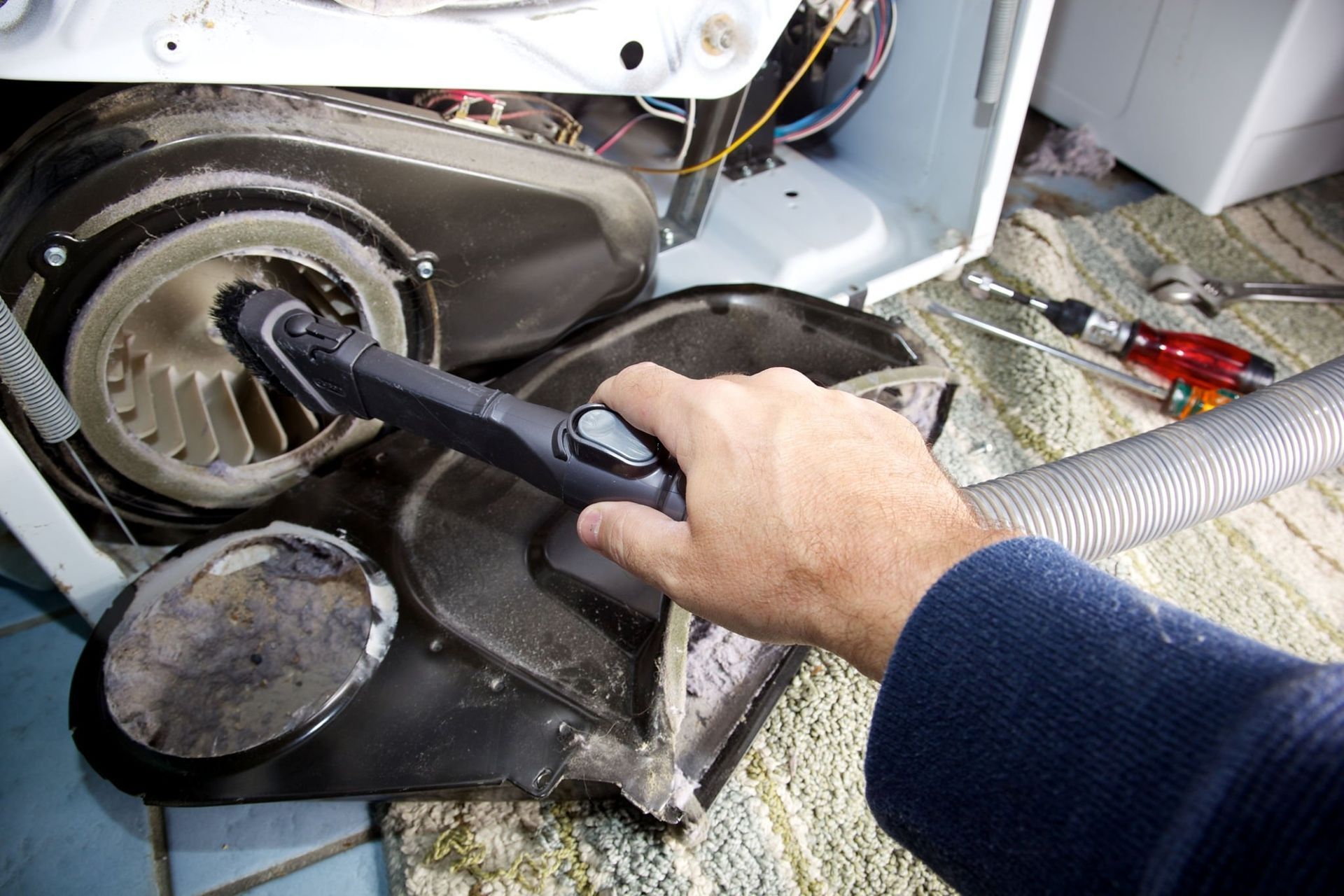 John B Laundry repairs a electric dryer servicing in Massachusetts Regions
