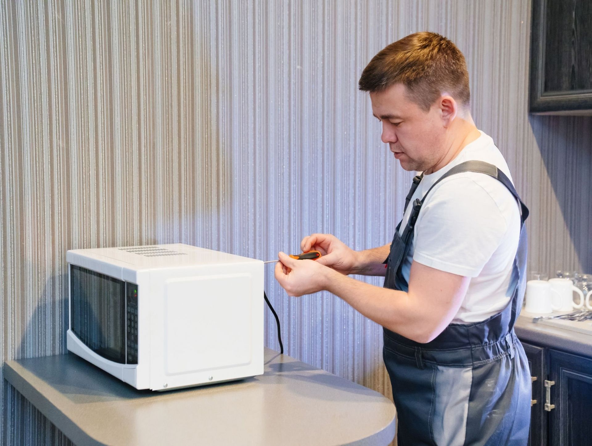 John B Laundry repairs a microwave servicing in  Massachusetts Regions