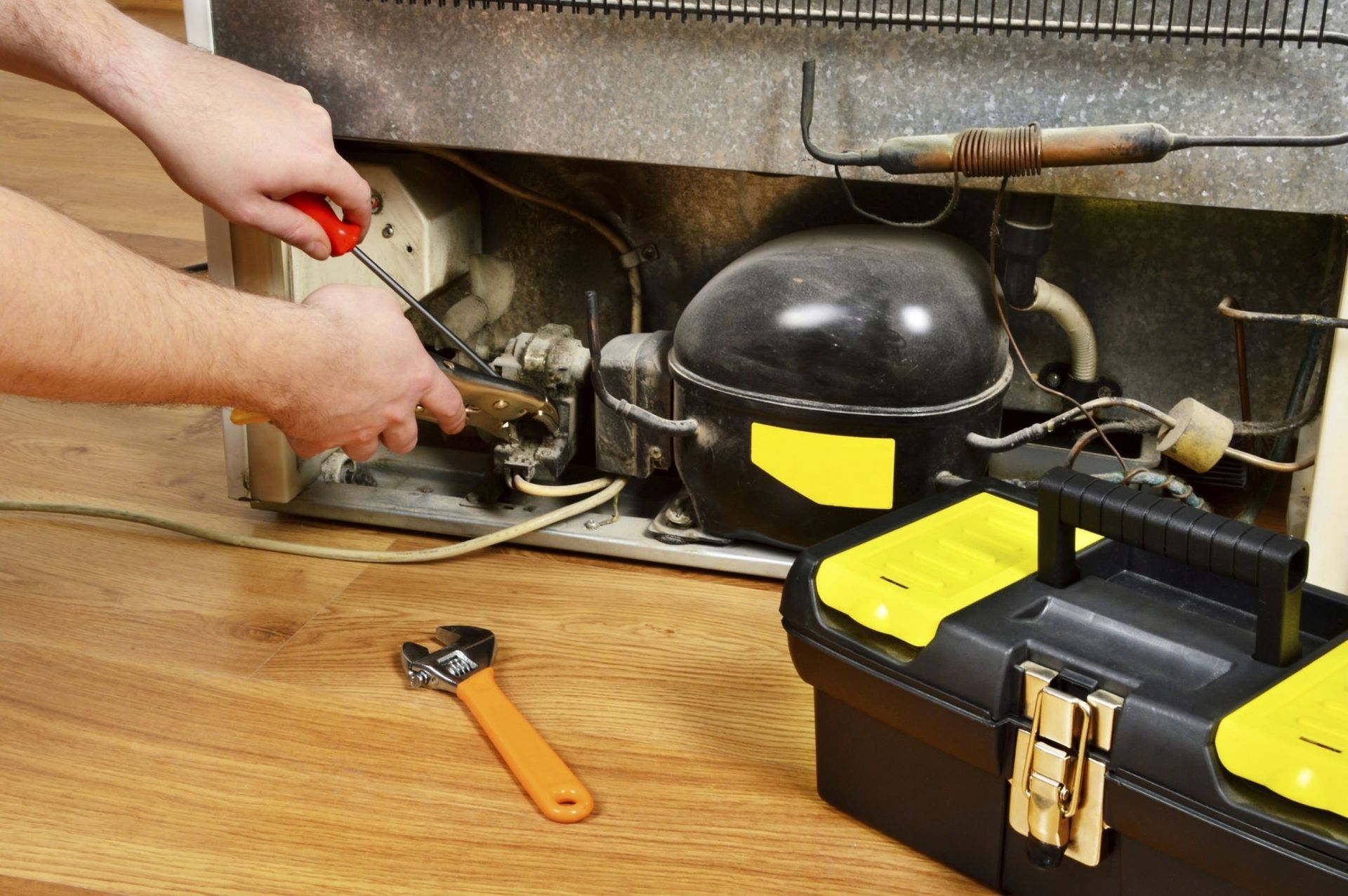 John B Laundry repairing a fridge servicing in Massachusetts Regions