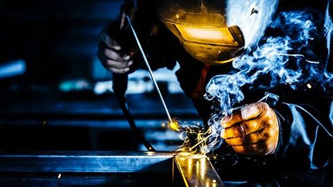 Man Working On Metal Welding — St. Louis, MO — Accurate Mechanical Contractors, Inc.