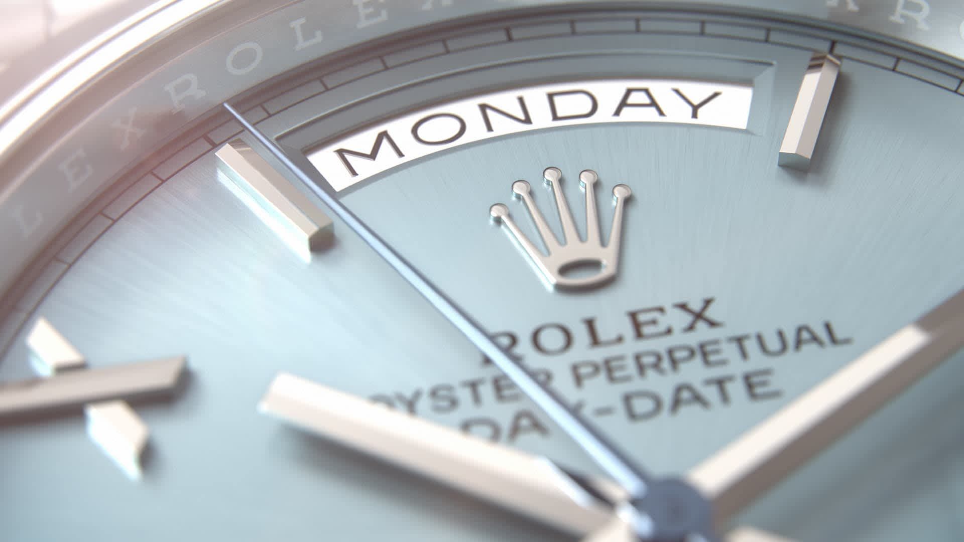 Close-up of a light blue Rolex watch face displaying 
