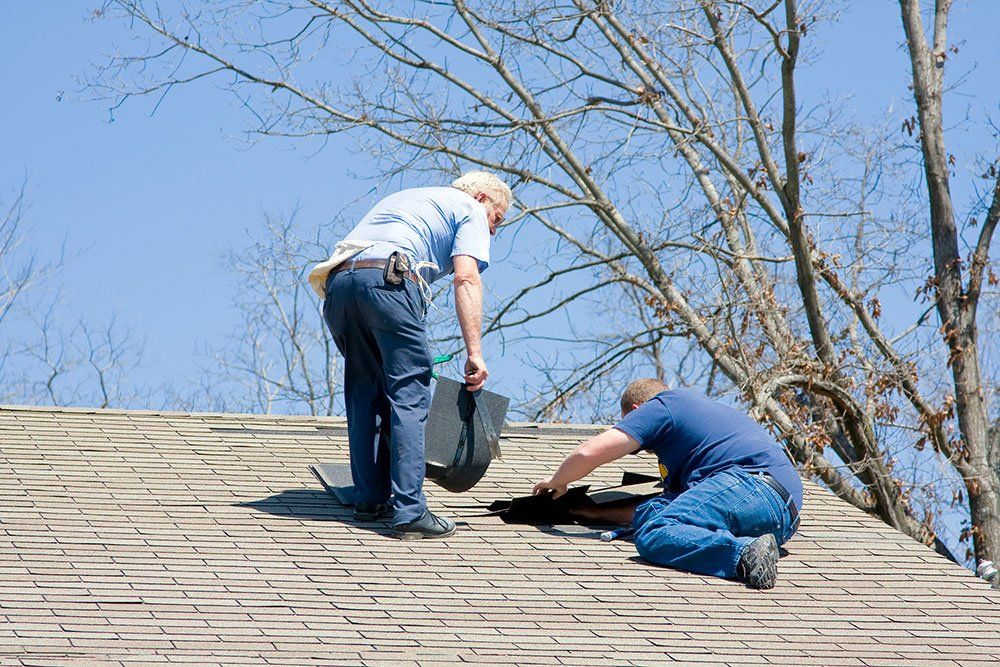 Workers Repair the Roof — Rochester, NH — New England Roofing
