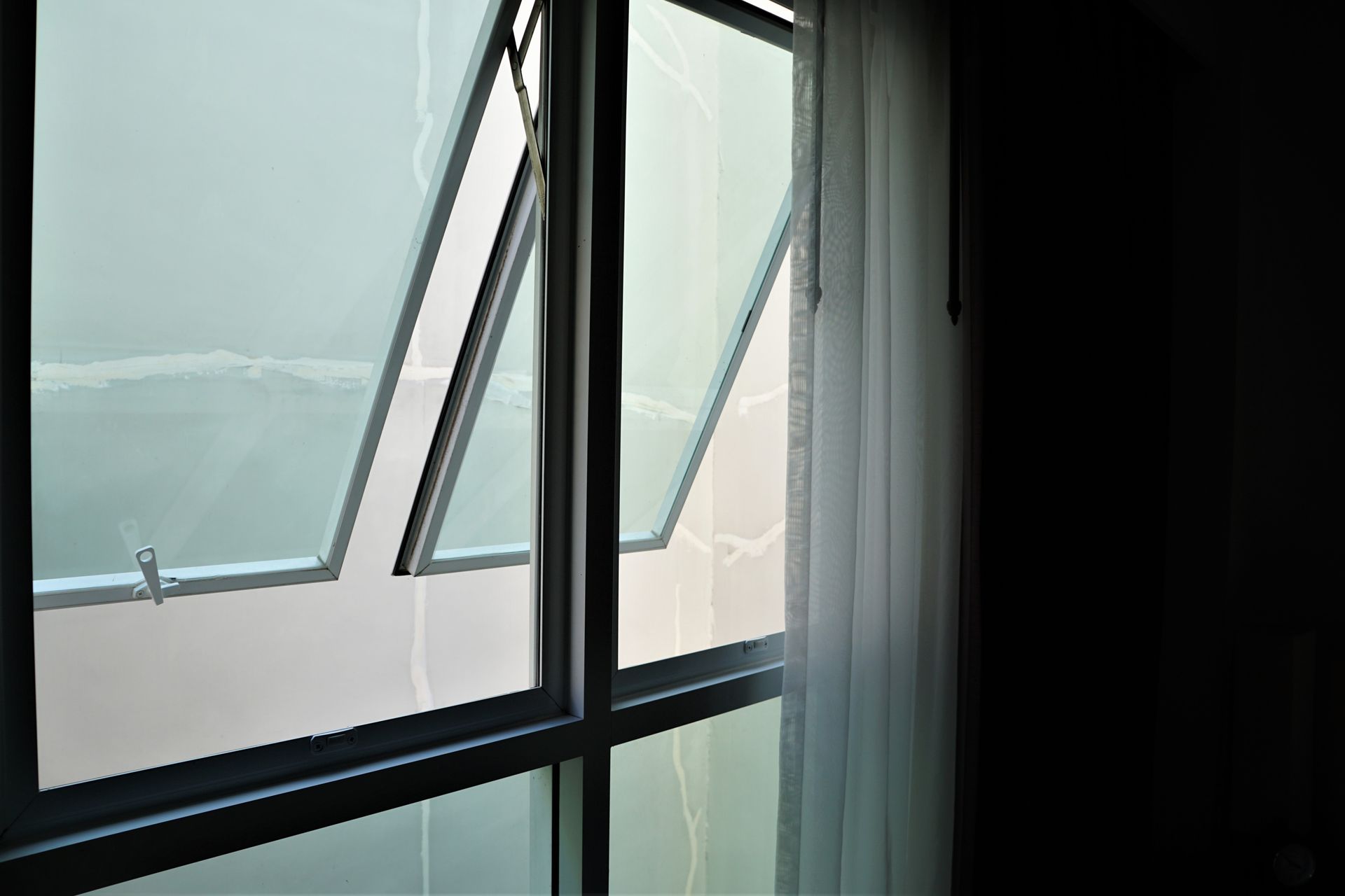 A Partially Opened Window With a Sheer Curtain Beside It — Long Jetty Glass in The Entrance, NSW