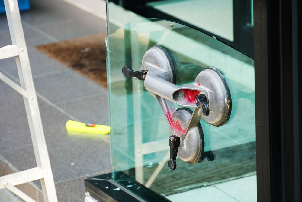 A Glass Panel is Being Lifted by a Two-suction Cup — Long Jetty Glass in The Entrance, NSW