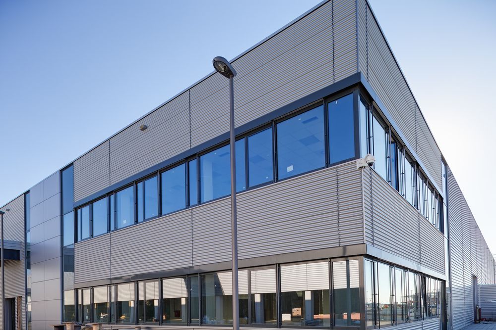 Modern Industrial Building With Light Blue Windows — Long Jetty Glass in The Entrance, NSW