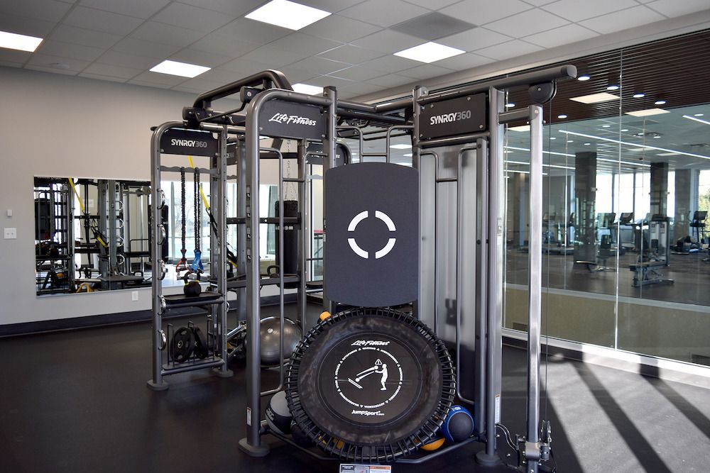 A gym with a lot of equipment and a tire on the floor at  Riley Towers, Indianapolis, IN. 
