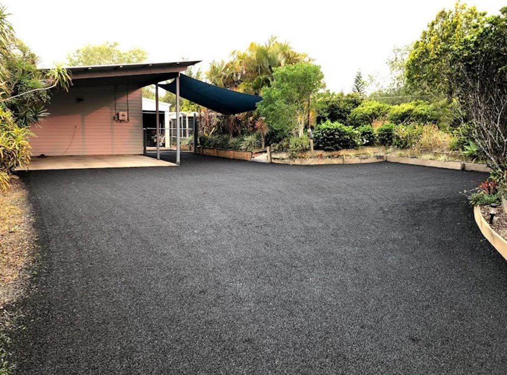 A Driveway Leading to a House With a Canopy Over It — North Coast Asphalts in Grafton, NSW