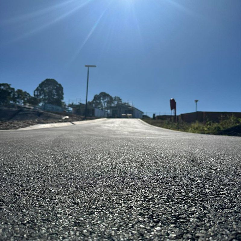 A Road With a Lot of Gravel on It — North Coast Asphalts in Corindi Beach, NSW