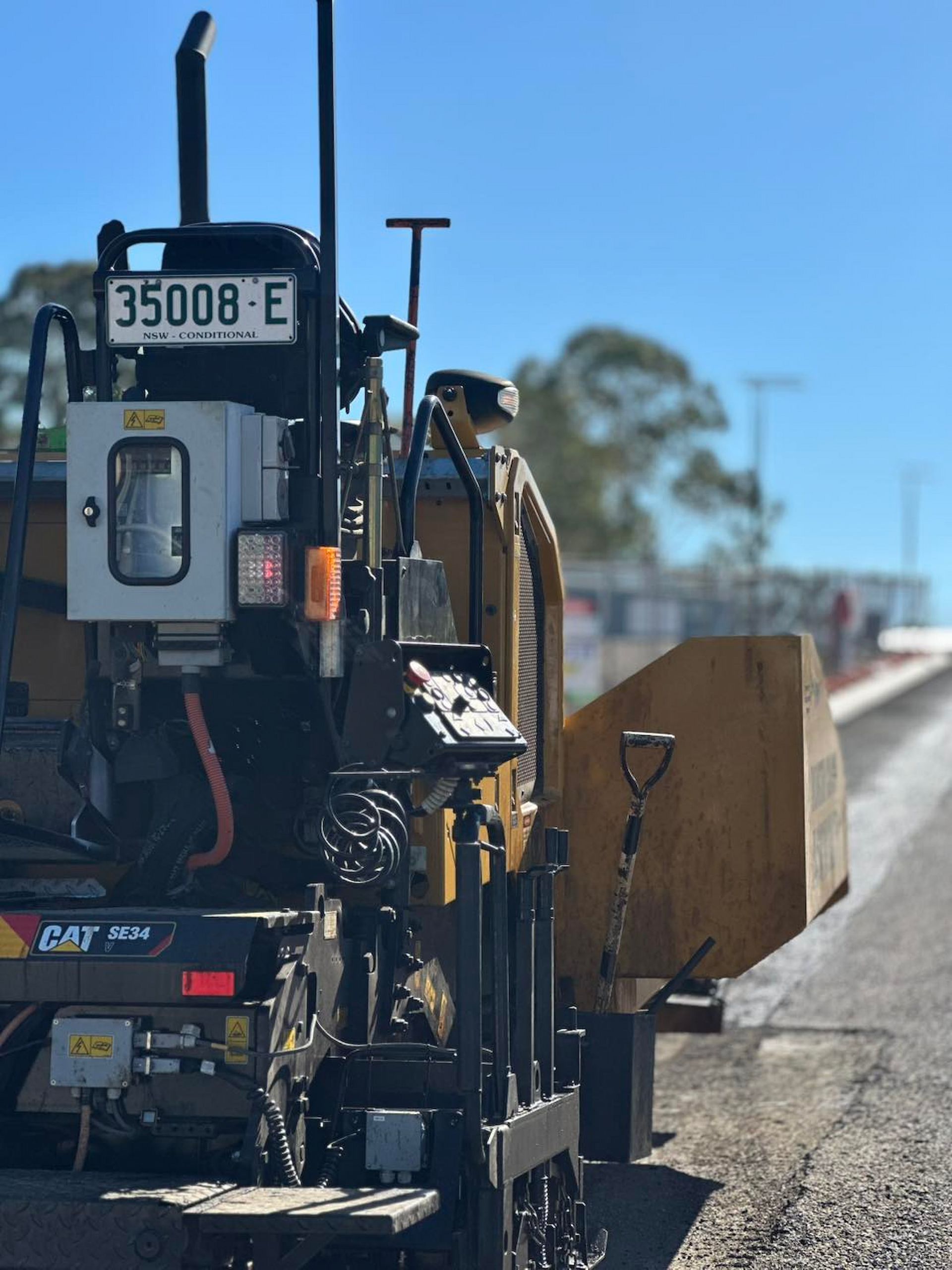 A Yellow Truck With a License Plate That Says 35008 E — North Coast Asphalts in Corindi Beach, NSW