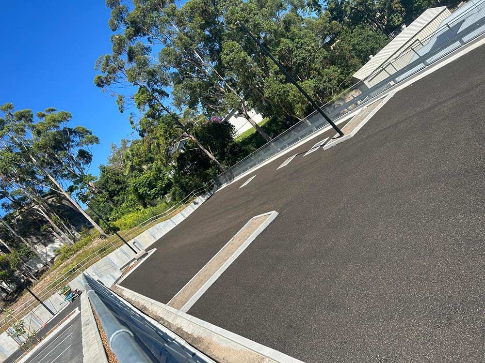 A Road With a Lot of Trees on the Side of It — North Coast Asphalts in Corindi Beach, NSW