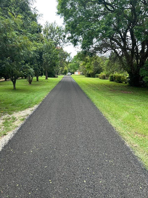 A Road Going Through a Park With Trees on Both Sides — North Coast Asphalts in Corindi Beach, NSW