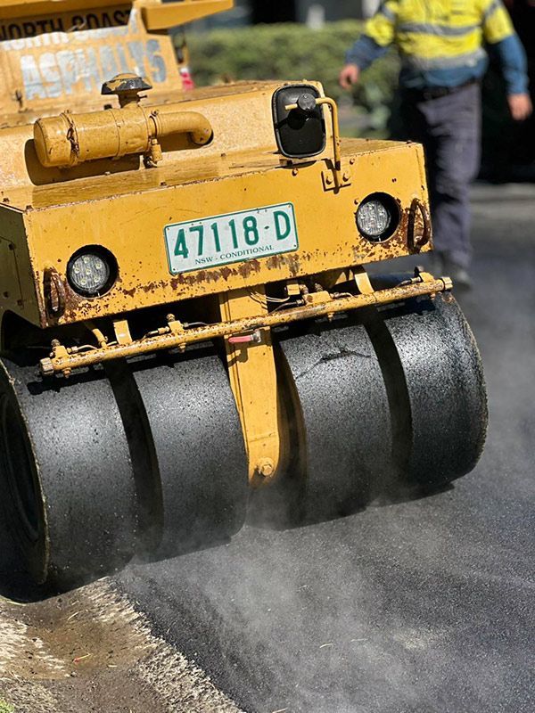 A Yellow Truck With a License Plate That Says 47118-d — North Coast Asphalts in Corindi Beach, NSW