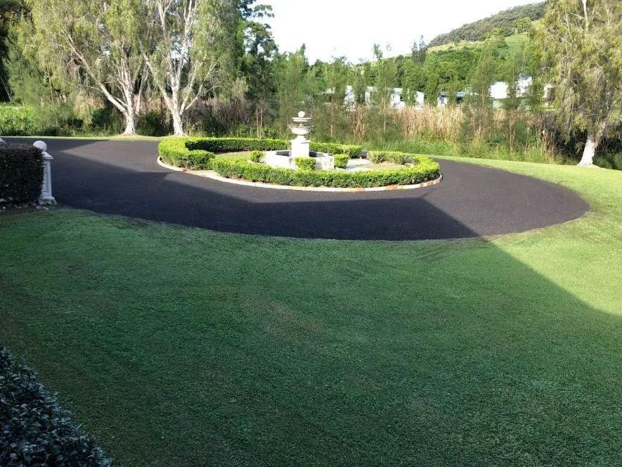 A Driveway With a Fountain in the Middle of It — North Coast Asphalts in Corindi Beach, NSW