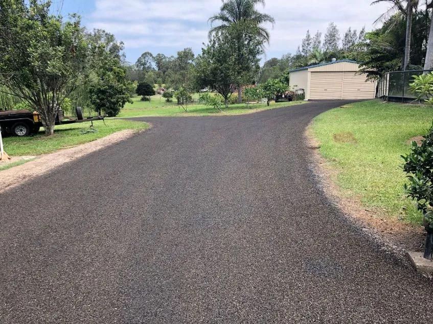 A Black Truck is Parked on the Side of a Road — North Coast Asphalts in Corindi Beach, NSW