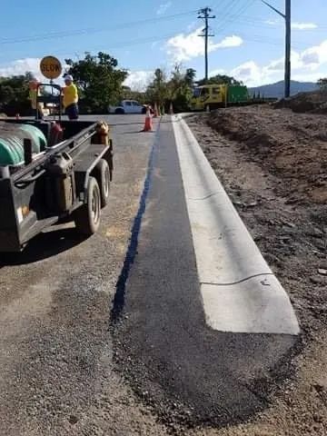 A Truck is Parked on the Side of a Road Next to a Curb — North Coast Asphalts in Corindi Beach, NSW