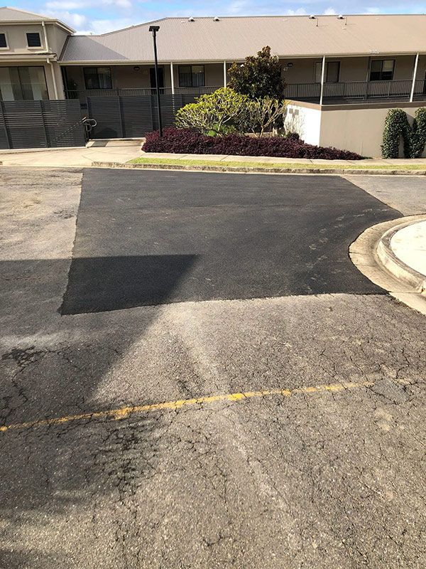 There is a Large Patch of Asphalt in the Middle of a Parking Lot — North Coast Asphalts in Corindi Beach, NSW