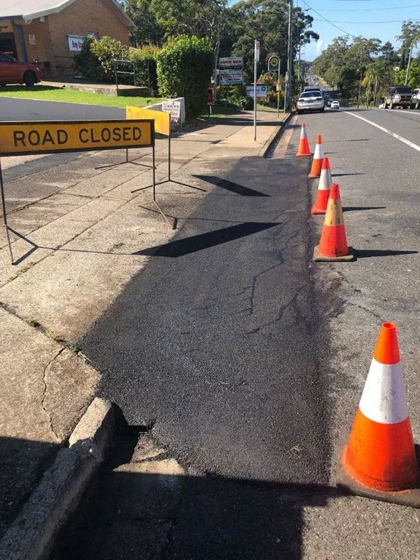 A Road With a Sign That Says Road Closed — North Coast Asphalts in Corindi Beach, NSW