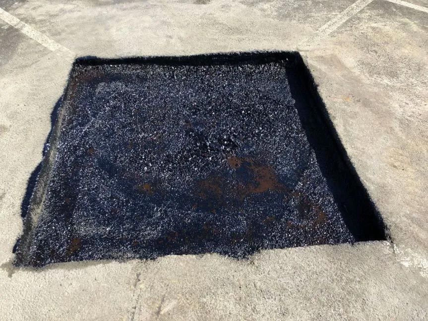 A Large Square Hole in the Ground in a Parking Lot — North Coast Asphalts in Corindi Beach, NSW