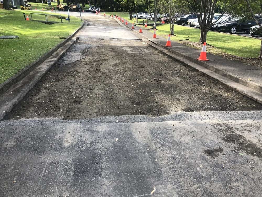 A Road With a Lot of Traffic Cones on It in a Park — North Coast Asphalts in Corindi Beach, NSW
