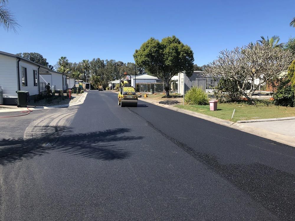 A Road is Being Paved in a Residential Area — North Coast Asphalts in Corindi Beach, NSW