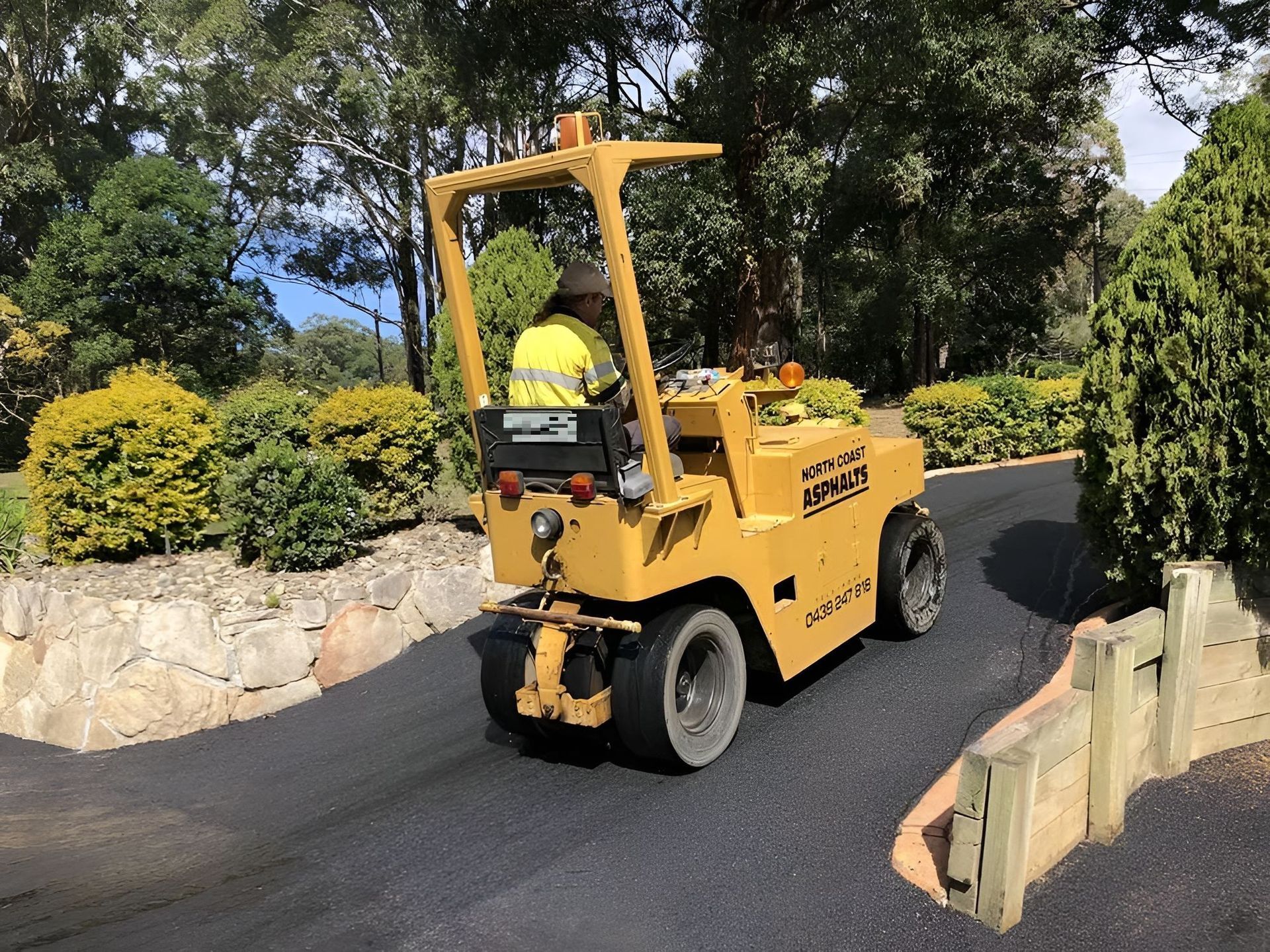 A long driveway surrounded by trees — North Coast Asphalts in Corindi Beach, NSW