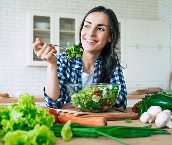 Woman Eating Vegetable Salad — Shingle Springs, CA — Reddy For Wellness