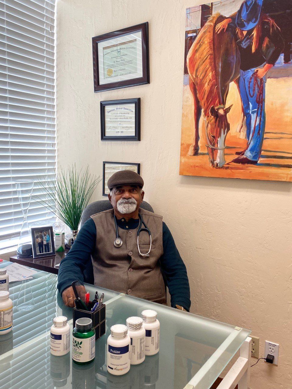 Dr Reddy Sitting on Desk — Shingle Springs, CA — Reddy For Wellness