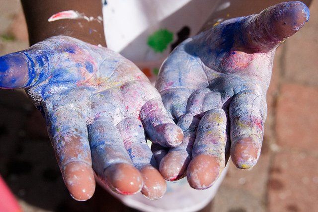 kids hands with paints