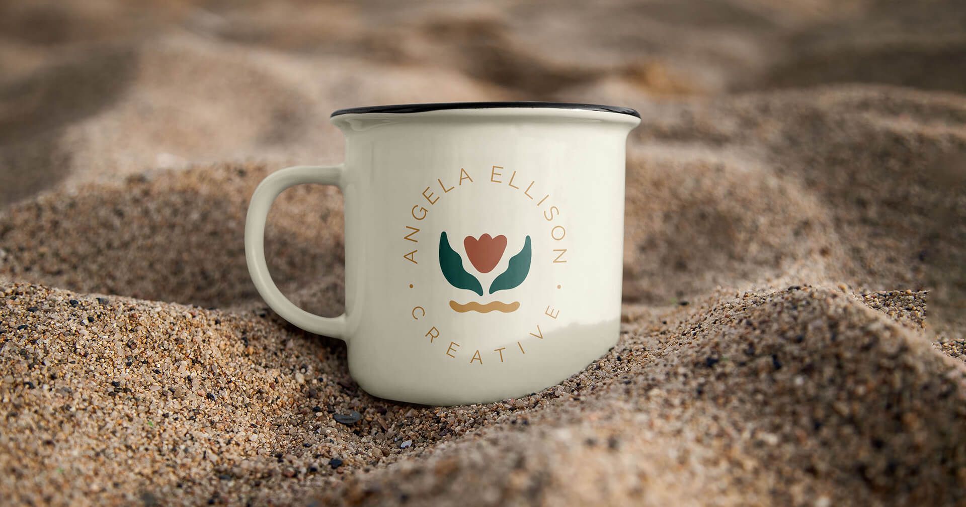 Rebrand for purpose-driven founder. Secondary logo on a ceramic mug, sitting in the sand.