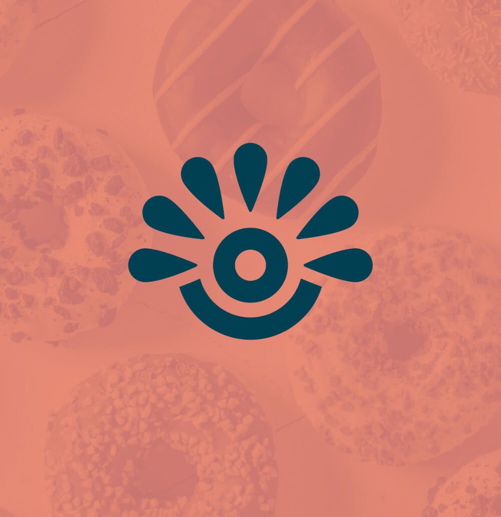 Creative logomark for food vendor displayed on top of a photo of donuts with a color overlay.