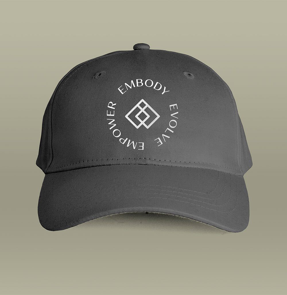 Secondary logo for community-driven business on a gray ball cap