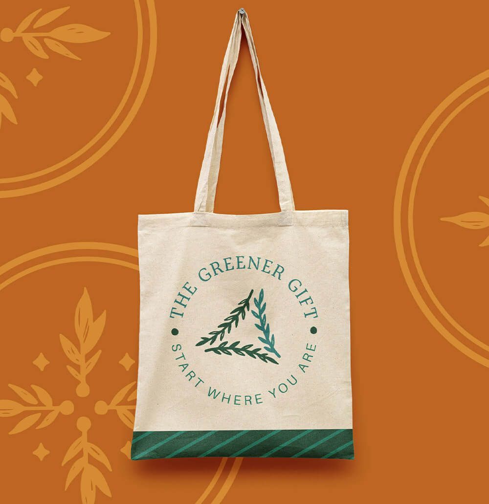 Canvas cotton tote bag with creative logo placed in the middle for sustainable , woman-owned business.