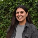 Sustainable small business owner smiling.