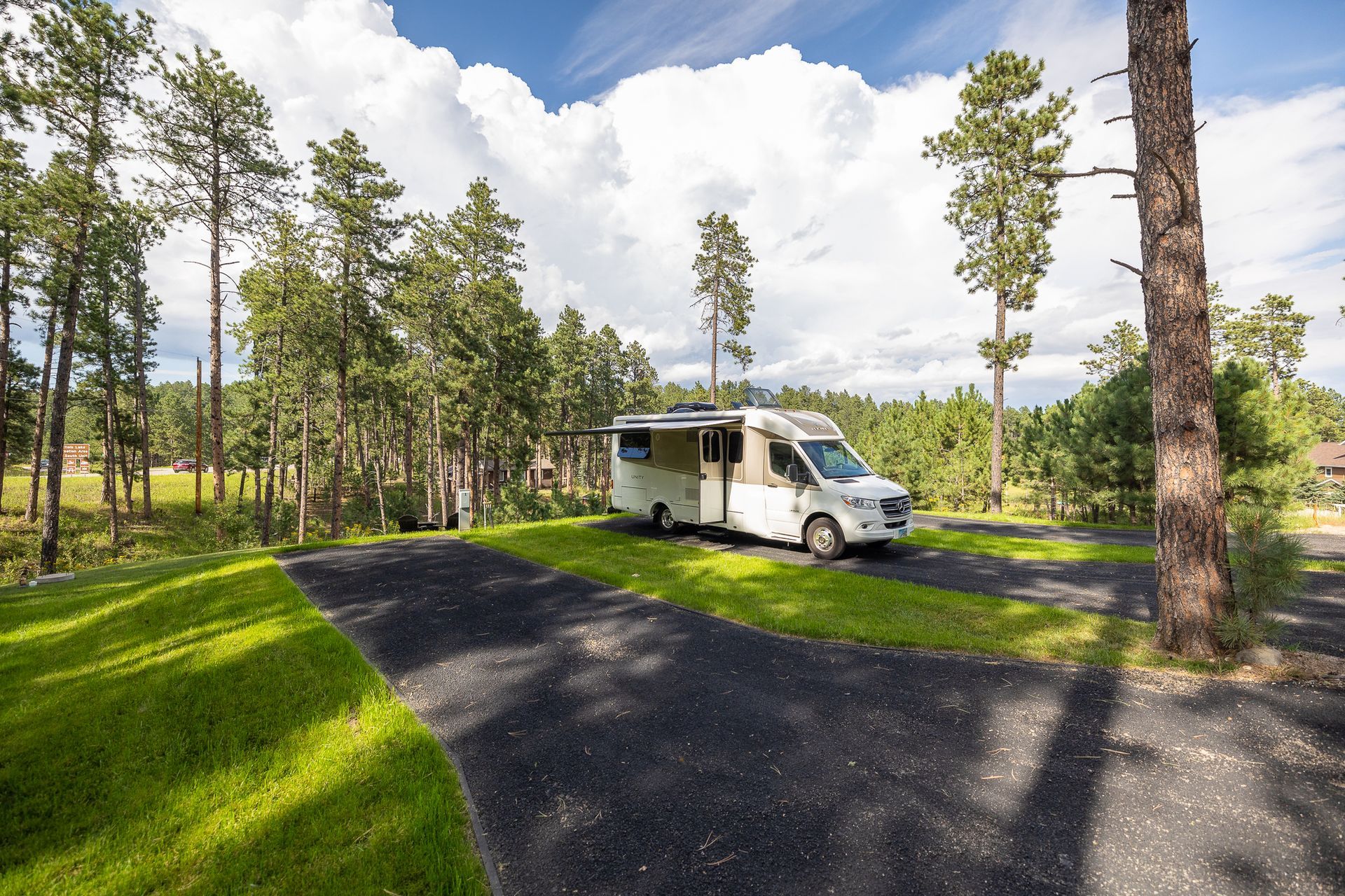 an rv is parked next to a concrete pad 