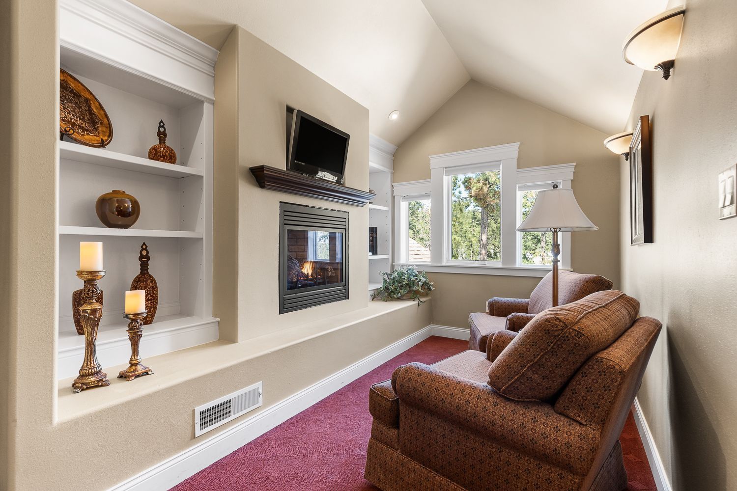 A living room with a fireplace and a couch