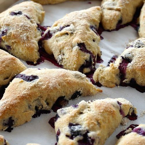 A close up of blueberry scones on a table