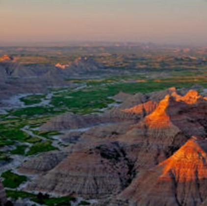 An aerial view of the badlands at sunset.