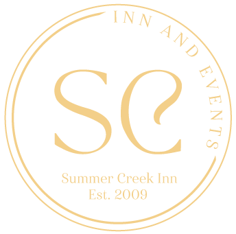 The logo for summer creek inn and events was established in 2009
