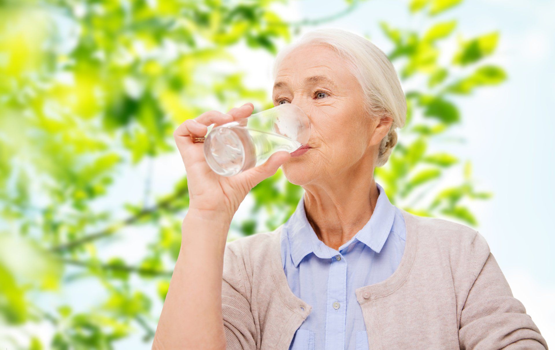 Elderly woman drinking water