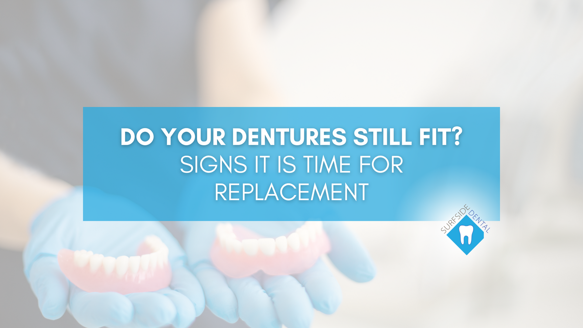 A person is holding a pair of dentures in their hands.