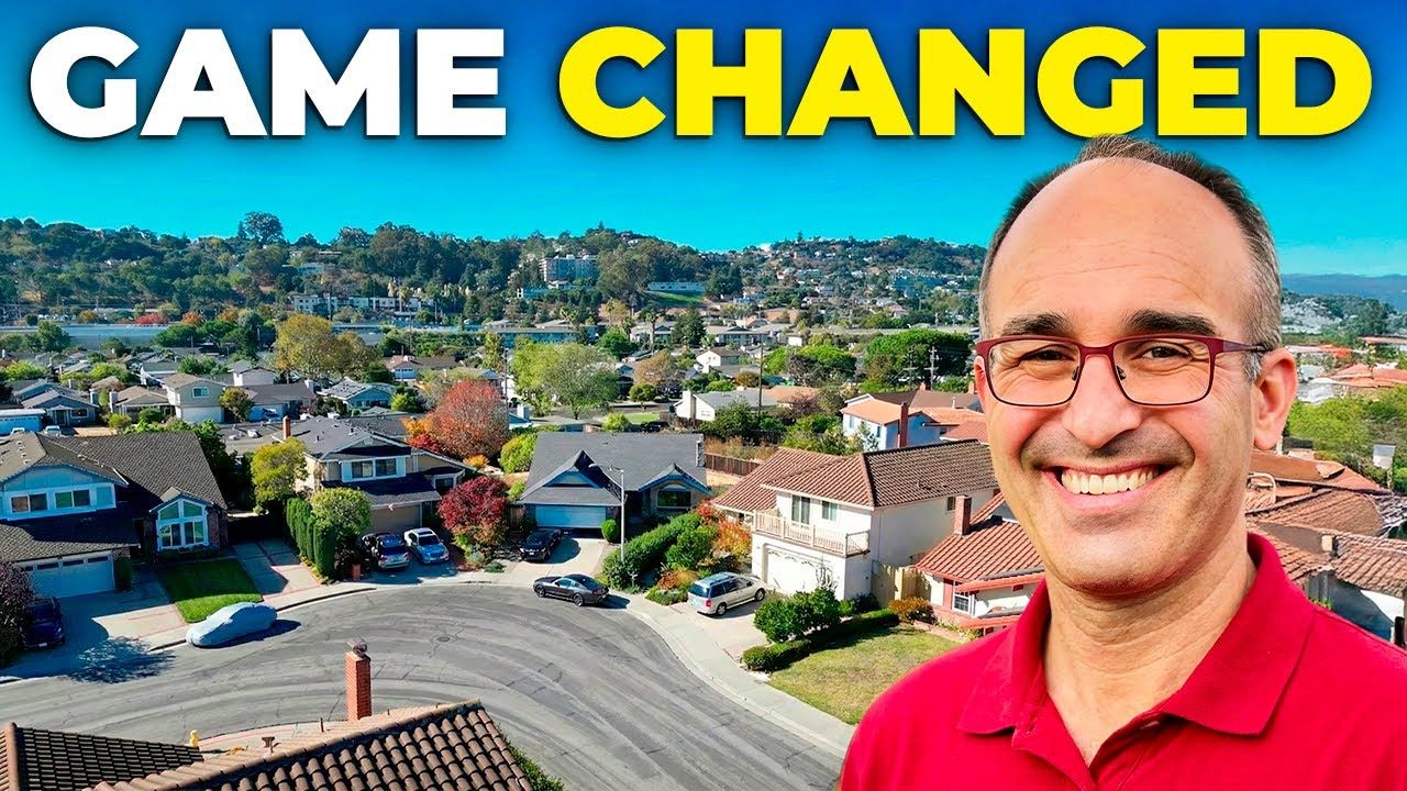 Man smiling in front of suburban homes; the words