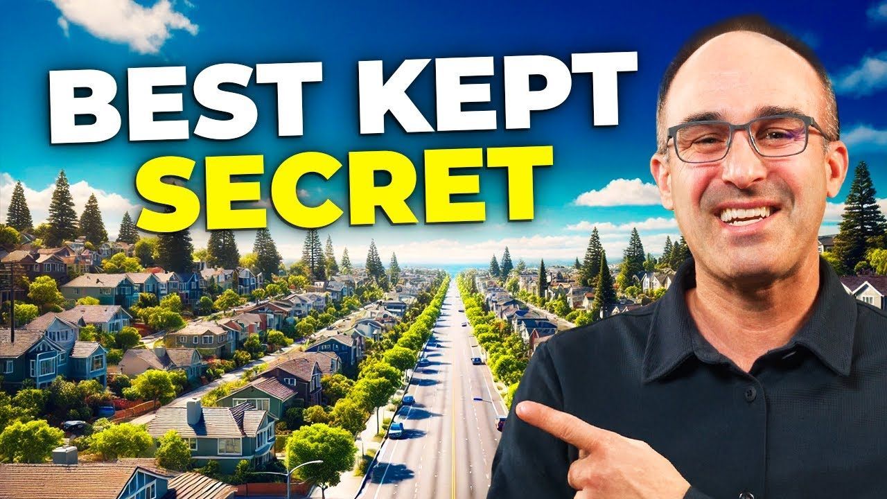 Man pointing at suburban street with the words