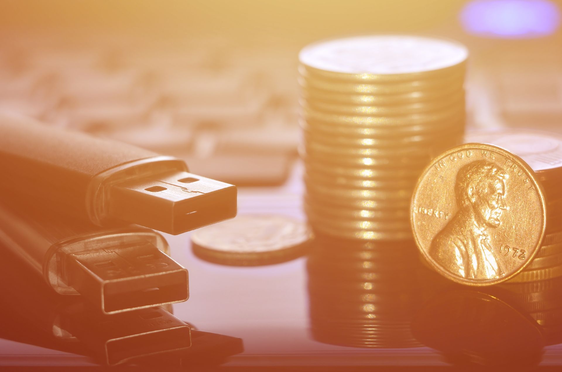 A penny is sitting on top of a pile of coins.